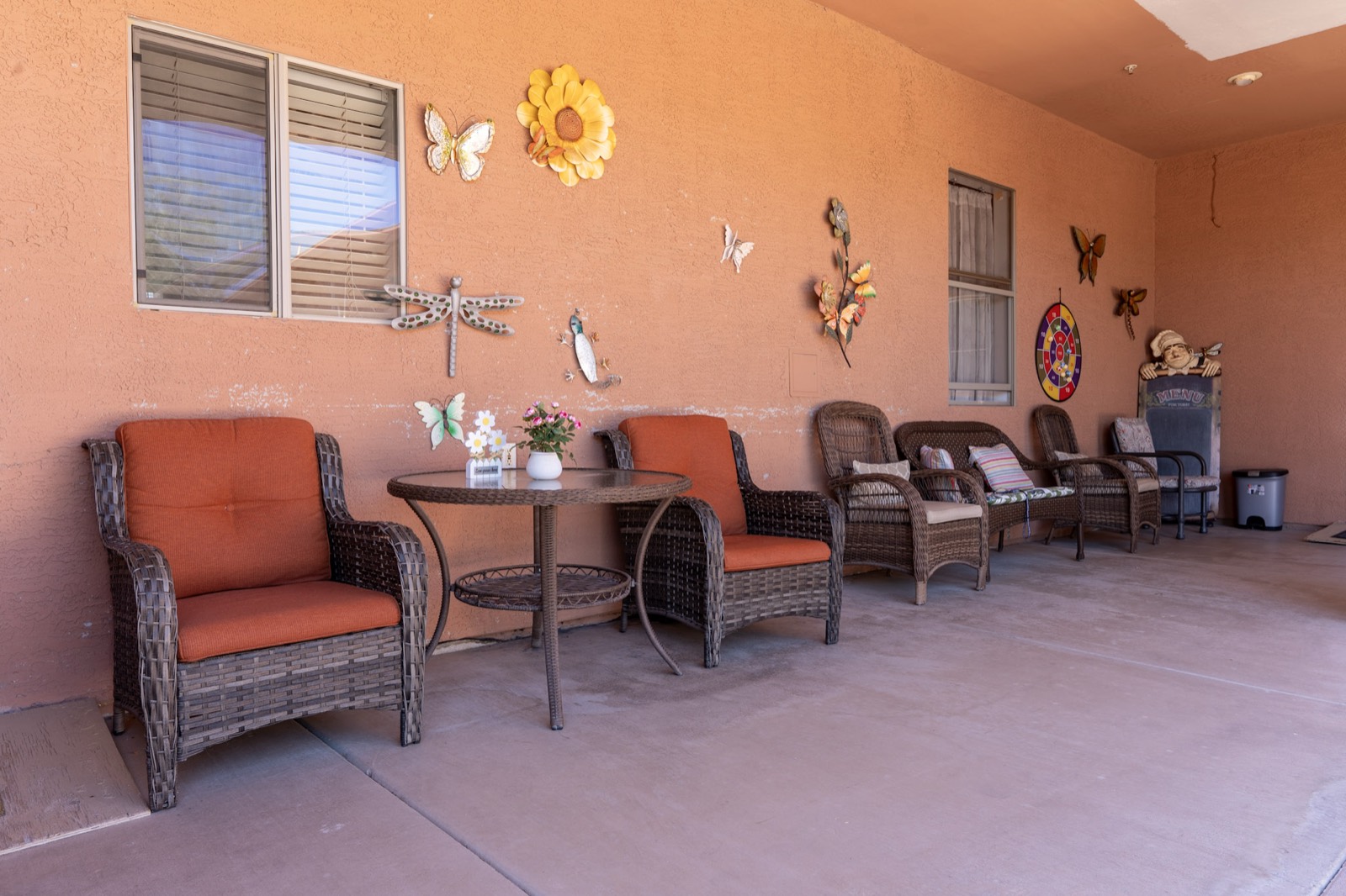 A welcoming covered patio with comfortable seating